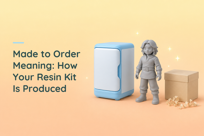 Made-to-order resin figure beside a blank printer and shipping box on a warm workshop background