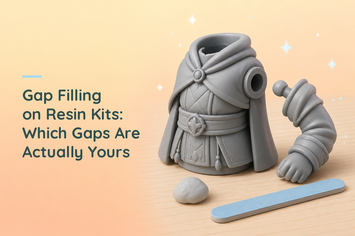 Cozy illustrated grey resin torso and separate arm showing the peg and socket join, with a ball of putty and a sanding stick