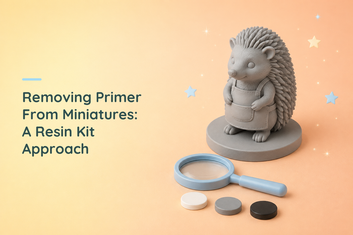 Grey resin hedgehog artisan beside a blue magnifying glass and white, grey and black sample discs