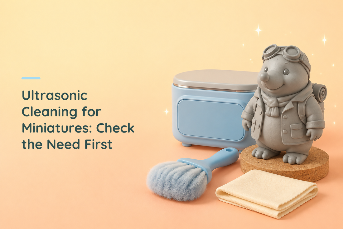 Grey resin mole explorer beside a closed idle ultrasonic cleaner, soft blue brush and folded cloth
