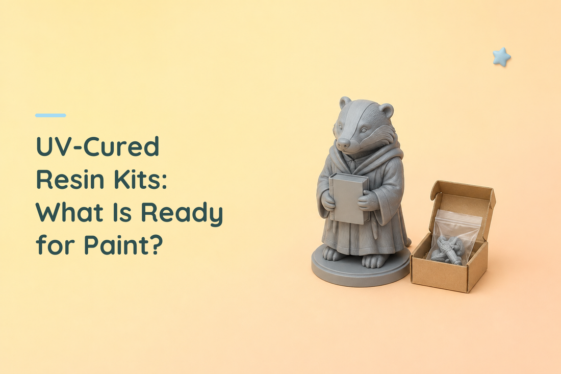 Grey resin badger scholar holding a book beside an open kraft box with a bagged grey accessory