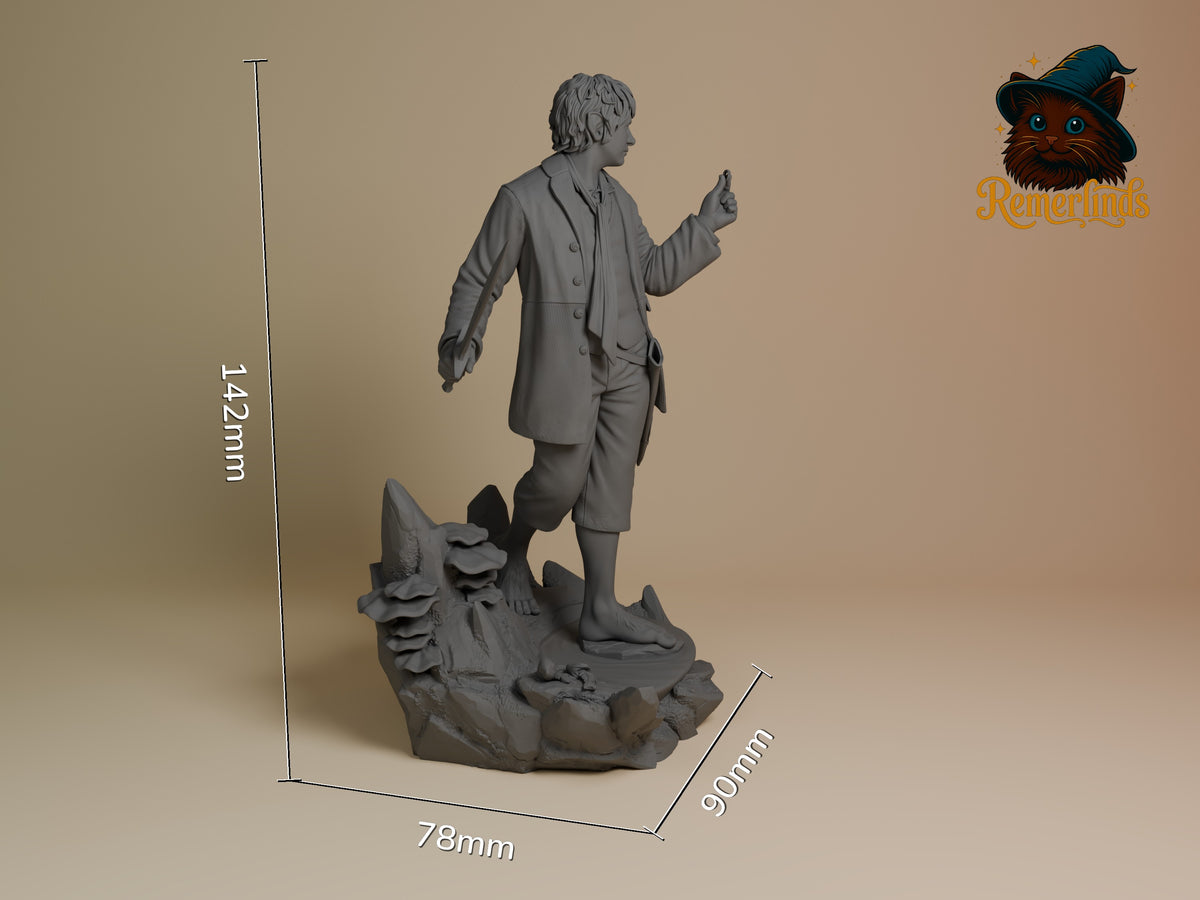 Bilbo Baggins from Lord of the Rings resin figure stands side-on, sword in hand, unpainted on a sculpted base.