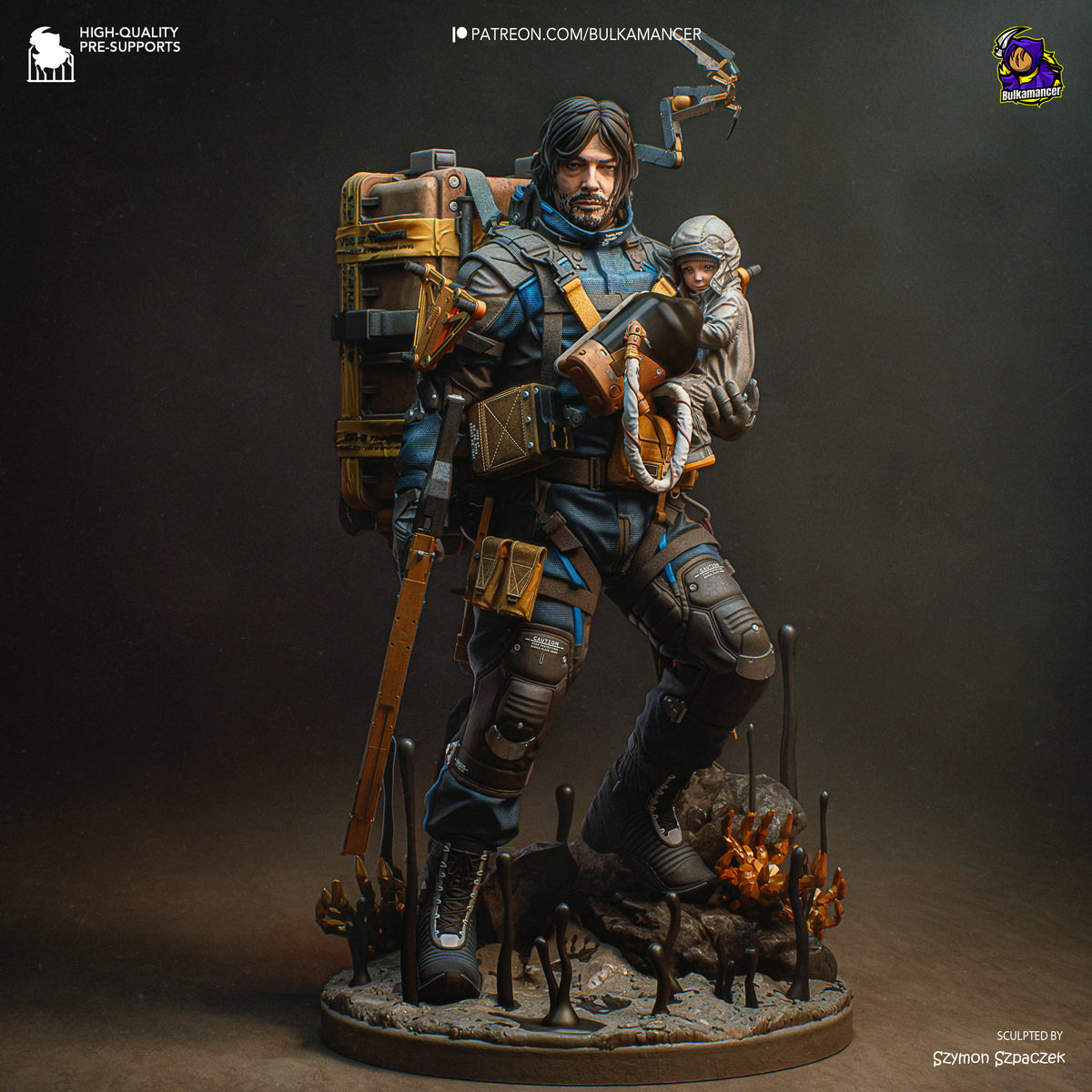 Painted resin figure of Sam from Death Stranding standing on rocky base, holding equipment and cargo, with child character visible on back.