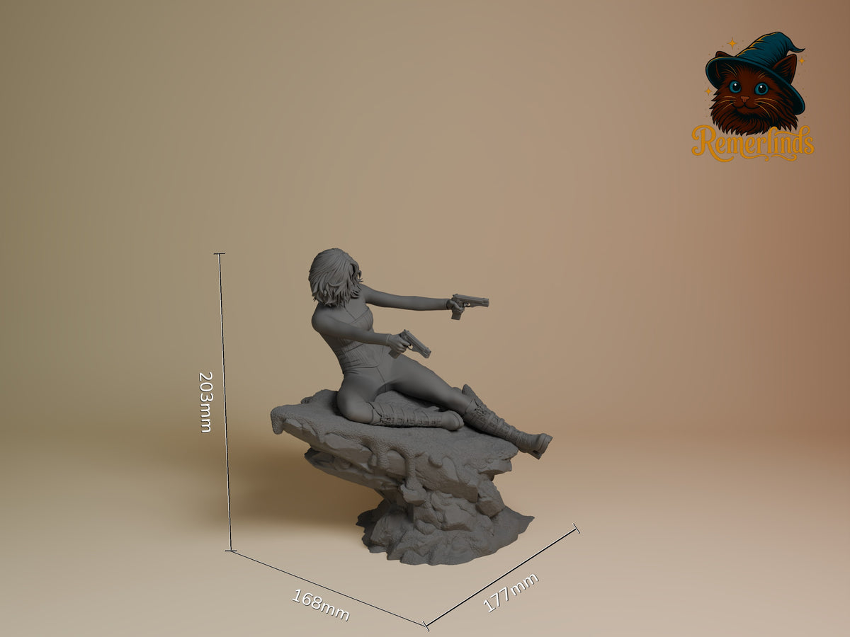 Selene from Underworld is an unpainted resin figure, seated with two guns on a sculpted base.