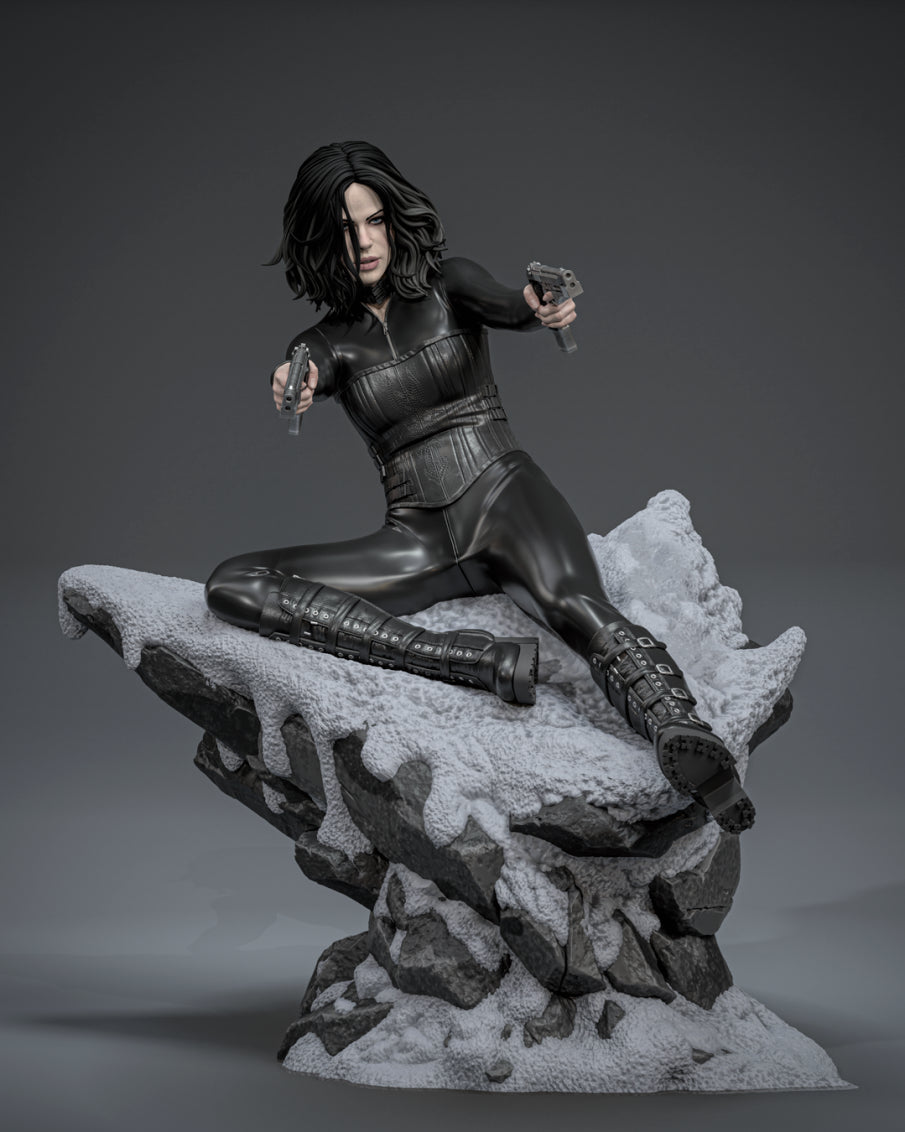 Painted Selene from Underworld resin figure kneels with two pistols on an unpainted rock base.