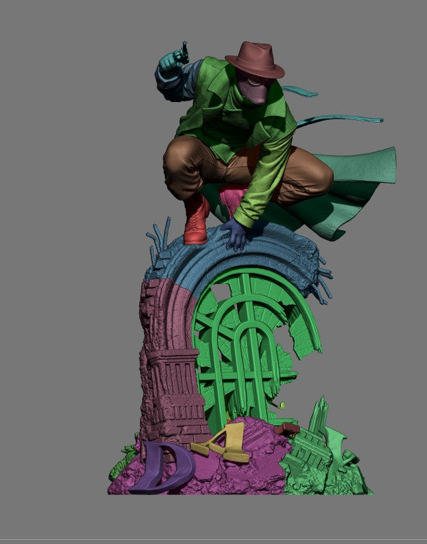 Riddler resin figure shown assembled on colorful layered base, displaying painted upper body in green jacket and brown pants with unpainted lower tower section in purple and green.