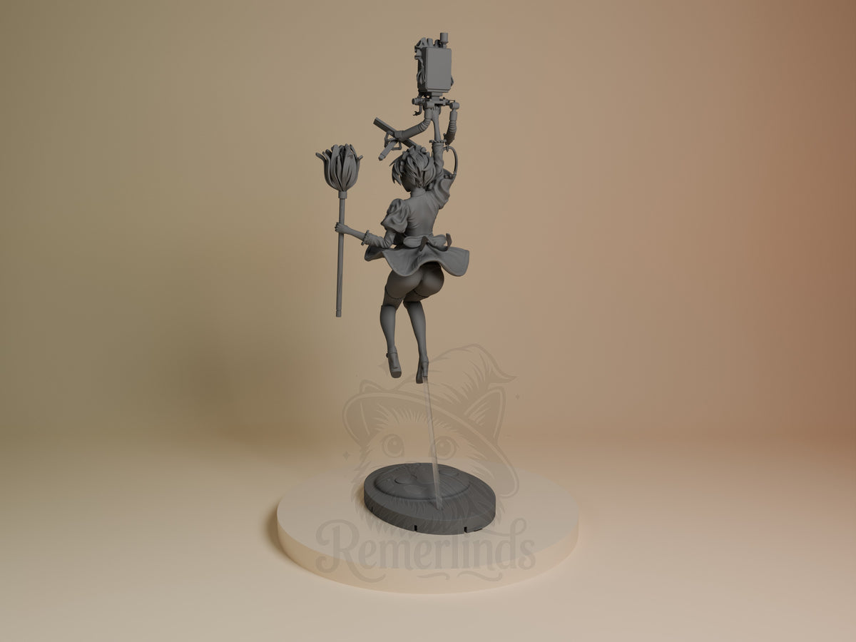 2B Maid resin figure from NieR: Automata shown from left angle in dynamic jumping pose, holding staff and flower, unpainted grey on dark base.