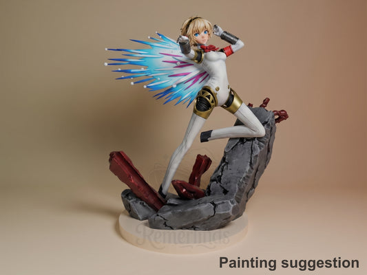 Aigis resin figure in dynamic pose on rocky base, white bodysuit with blue-pink wing effects, gold armor details, blonde hair, red accents, fully painted.