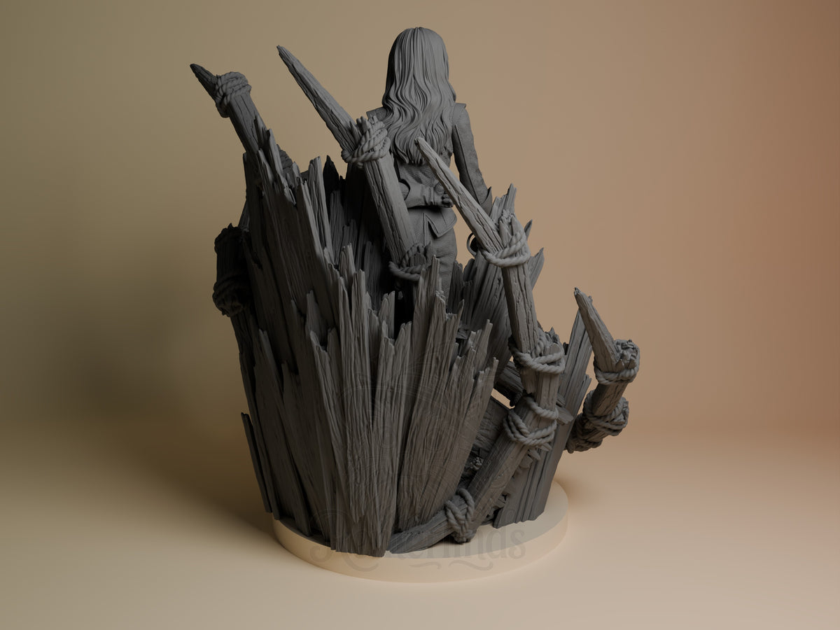 Alicia from Expedition 33 resin figure shown from back, perched on jagged rocky base, long hair flowing, unpainted gray resin.