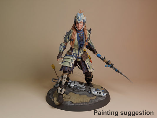 Aloy from Horizon resin figure painted in blue and cream armor, wielding spear and bow, standing on rocky base with scattered weapons.