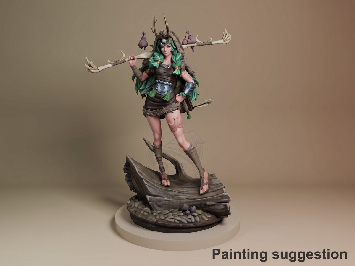 Artemis resin figure from Hades, painted in green and brown, posed dynamically with dual staffs on a sculpted base, front three-quarter view.