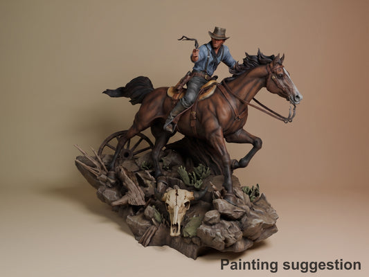 Arthur Morgan resin figure on rocky desert base with skull, painted in blue shirt and hat, mounted on rearing brown horse, holding lasso.