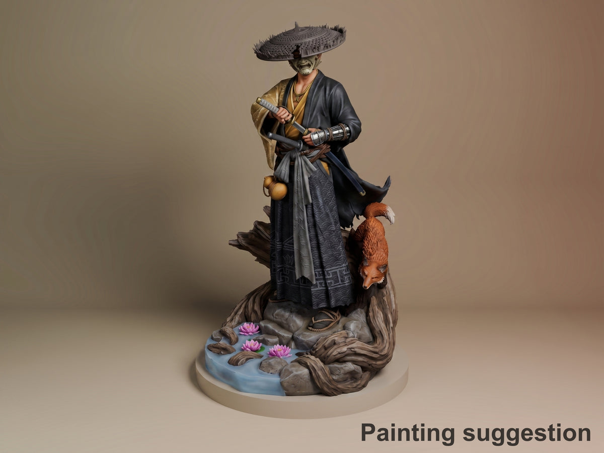 Painted resin figure of Atsu from Ghost of Yotei standing on rocky base with pink flowers, wielding sword and holding staff, wearing traditional black and gold robes with large hat.
