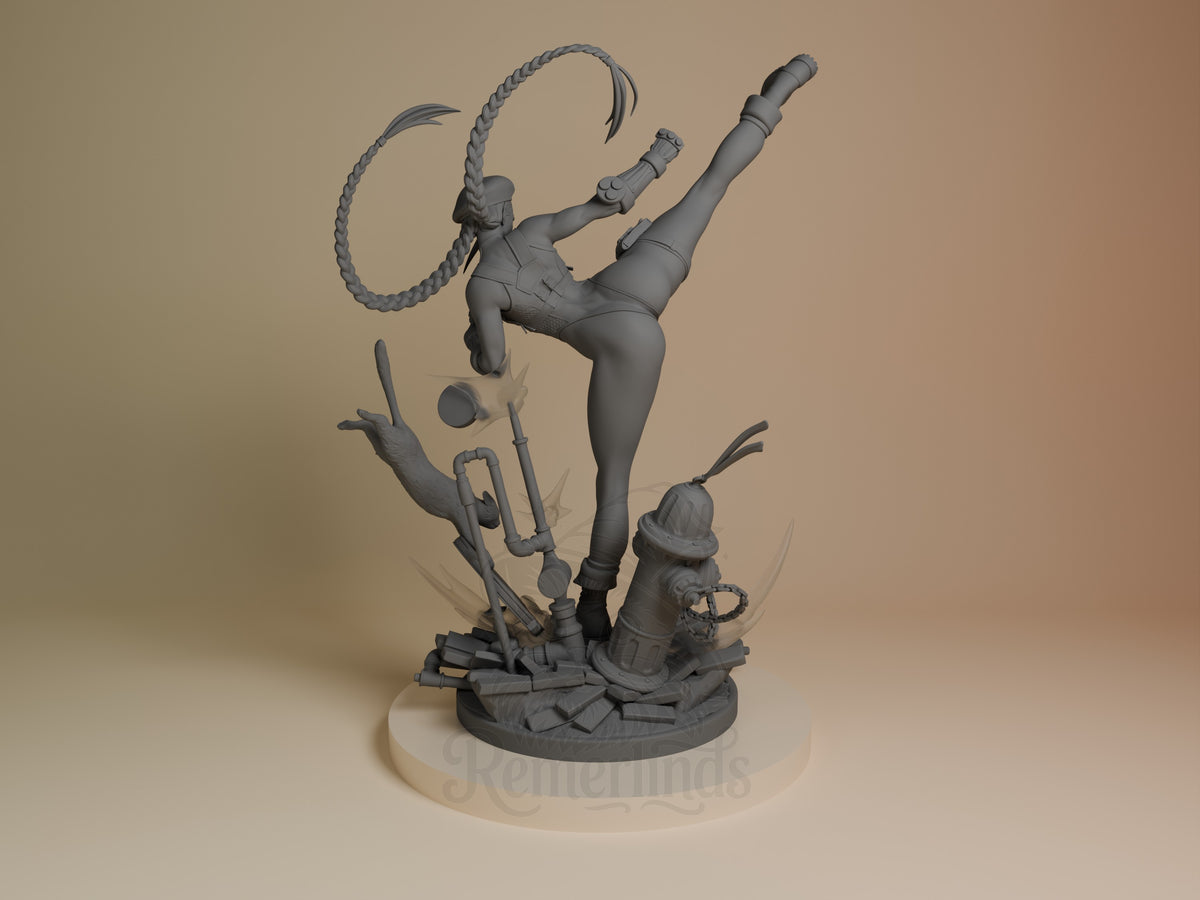 Cammy resin figure from Street Fighter shown from back angle, unpainted gray, mid-action pose with lasso rope, detailed base with props and fire hydrant.