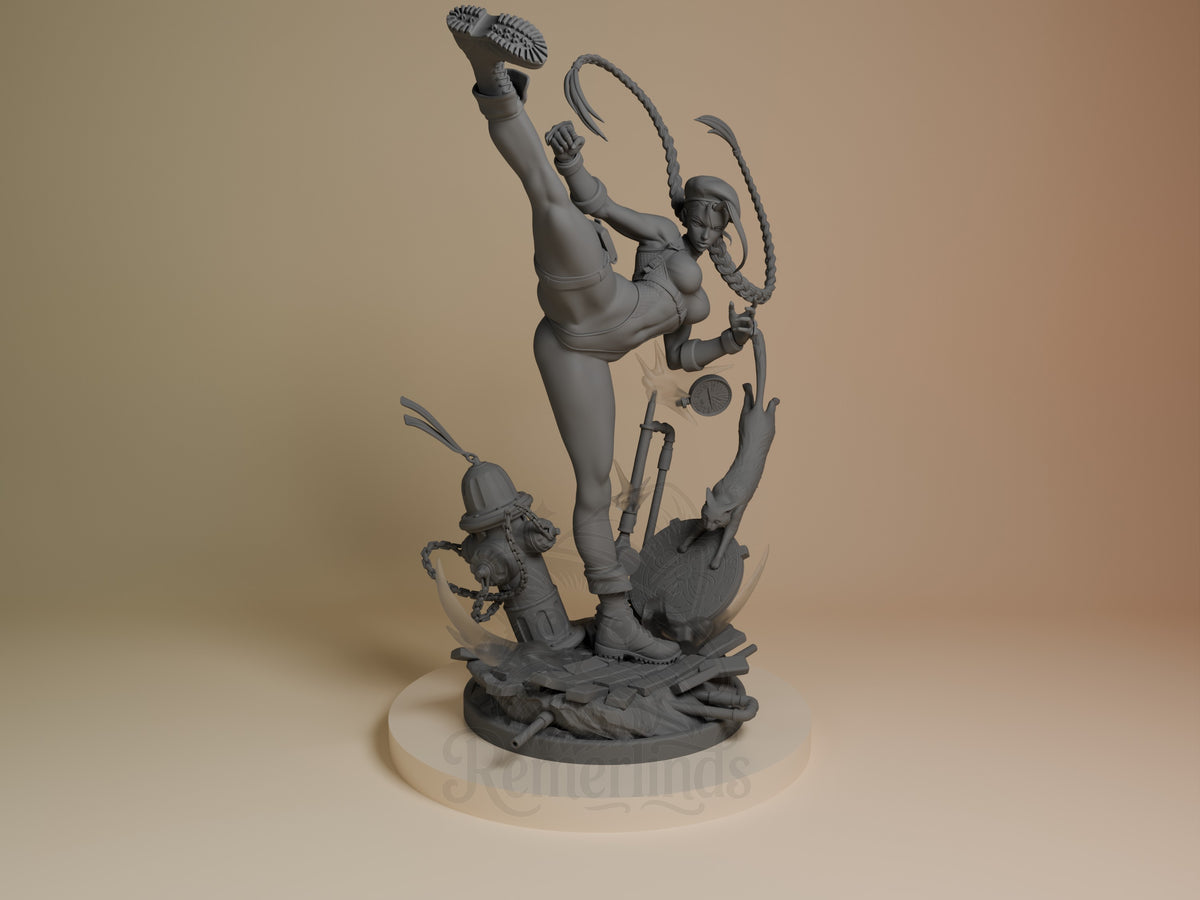 Cammy resin figure in dynamic kicking pose with whip, unpainted gray finish, shown from front angle on circular base.