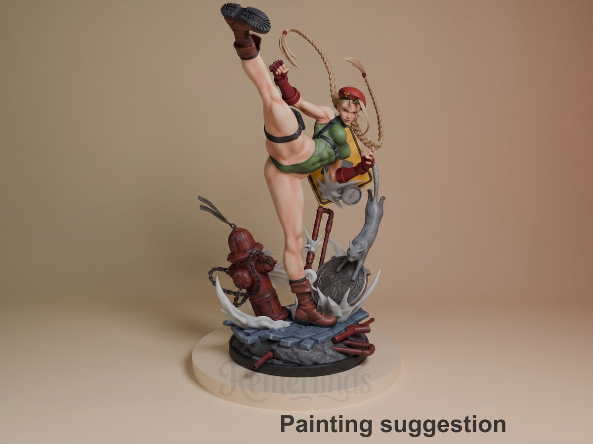 Cammy resin figure painted in green and red outfit, mid-kick pose with rope, dynamic base with fire hydrant and debris details.