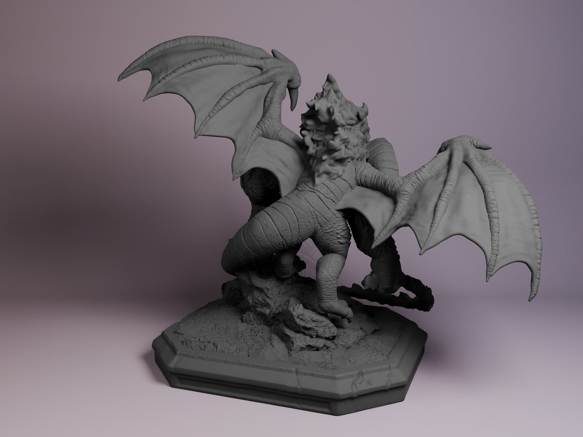 Rear view of Balrog from Lord of the Rings, an unpainted resin Chibi figure with wings on a sculpted base.