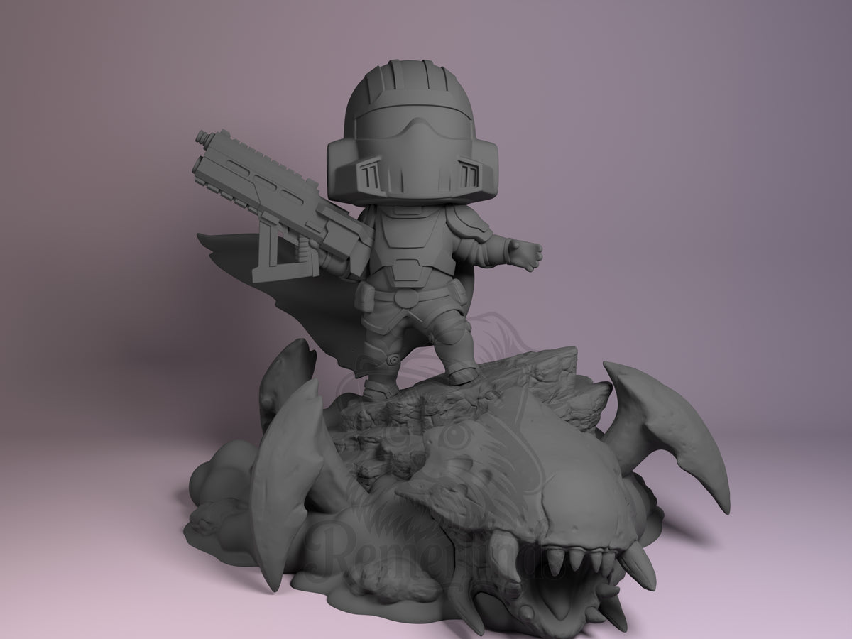Bugstorm Diver Galactic Bug War 3D printed resin figure by Nomnom, unpainted front view. The figure stands heroically on top of a defeated alien bug, brandishing a large futuristic rifle with an outstretched arm, clad in detailed armor and helmet. Its small chibi-style proportions are complemented by a flowing cape and a dynamic pose, capturing a triumphant scene on a detailed base featuring the defeated creature's head and limbs.