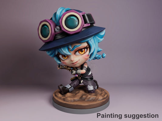 Isha resin Chibi figure from Arcane, painted in vibrant colors with blue hair, purple goggles, black outfit, displayed on brown base against purple background.