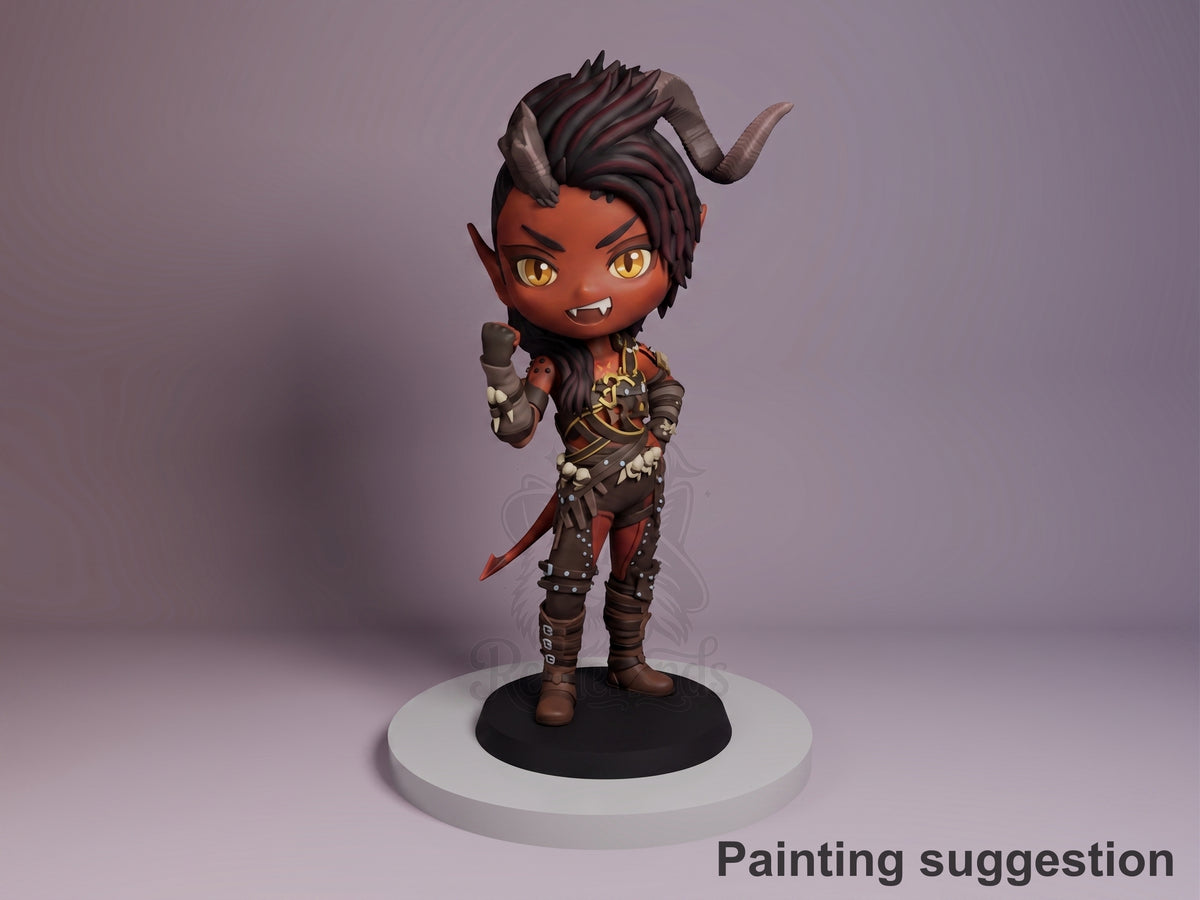 Karlach resin Chibi figure from Baldur's Gate 3, painted in dark skin tones with horns and gold eyes, posed standing on white base against purple background.