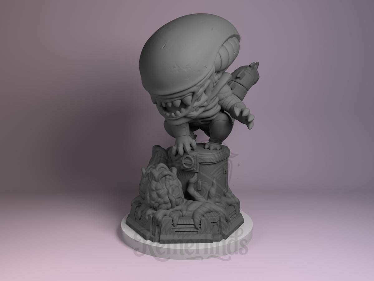 Xenobeast Broodling Deep Space Horror 3D printed resin figure by Nomnom, unpainted front view. The figure depicts a chibi-style xenomorph alien crouched on one knee atop a detailed sci-fi base with biomechanical and organic elements. The alien has a large elongated head with sharp teeth and clawed hands reaching forward, capturing a menacing yet stylized appearance. The base combines mechanical and organic features, enhancing the overall deep space horror theme.