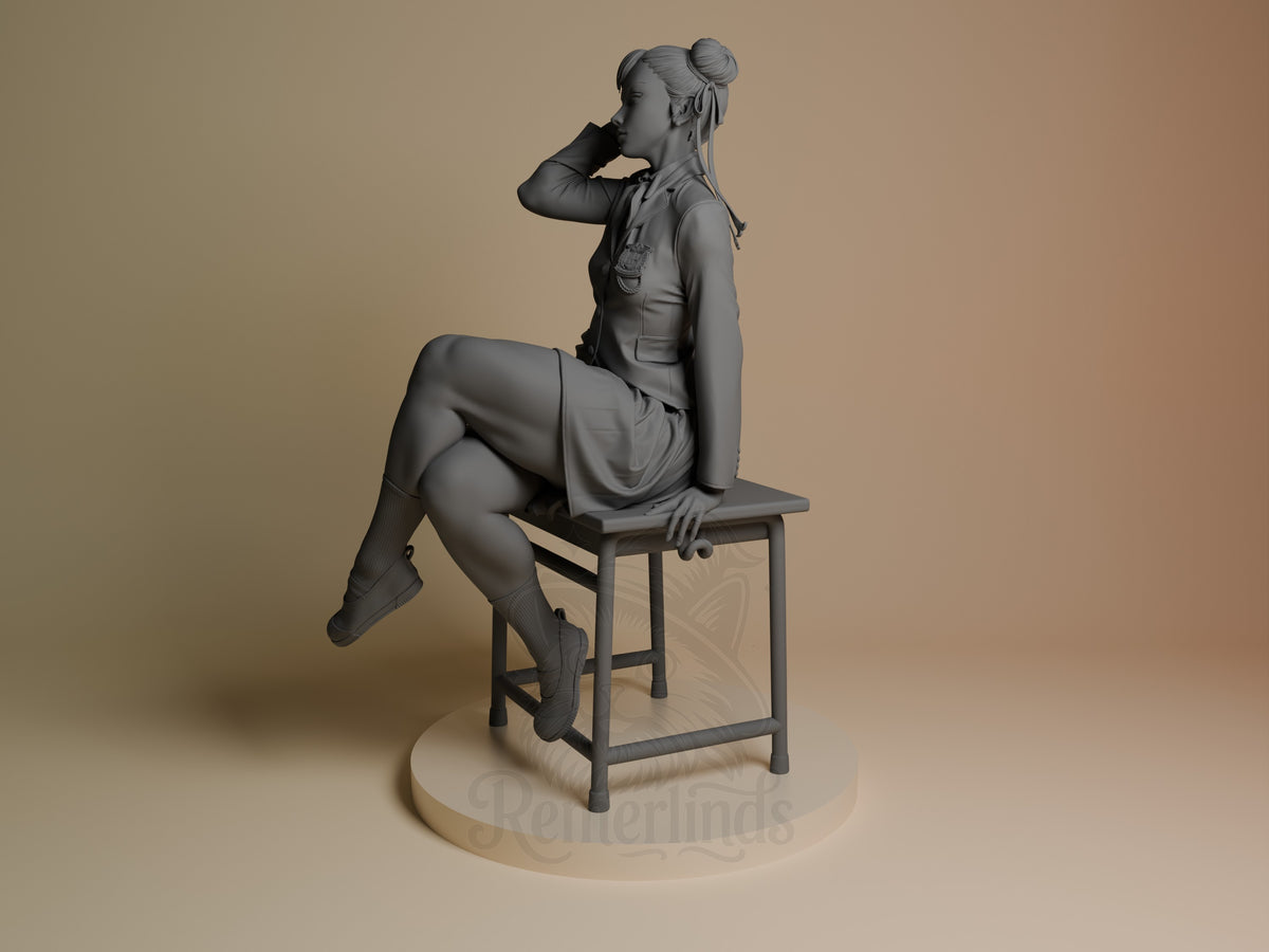 Chun-Li resin figure shown at angle seated on stool, displaying sculpted details and monochromatic finish against neutral base.