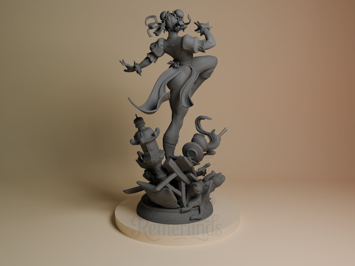 Chun-Li resin figure from Street Fighter shown from behind in dynamic pose on base, unpainted gray prototype displaying detailed sculpting of hair, outfit, and martial arts stance.