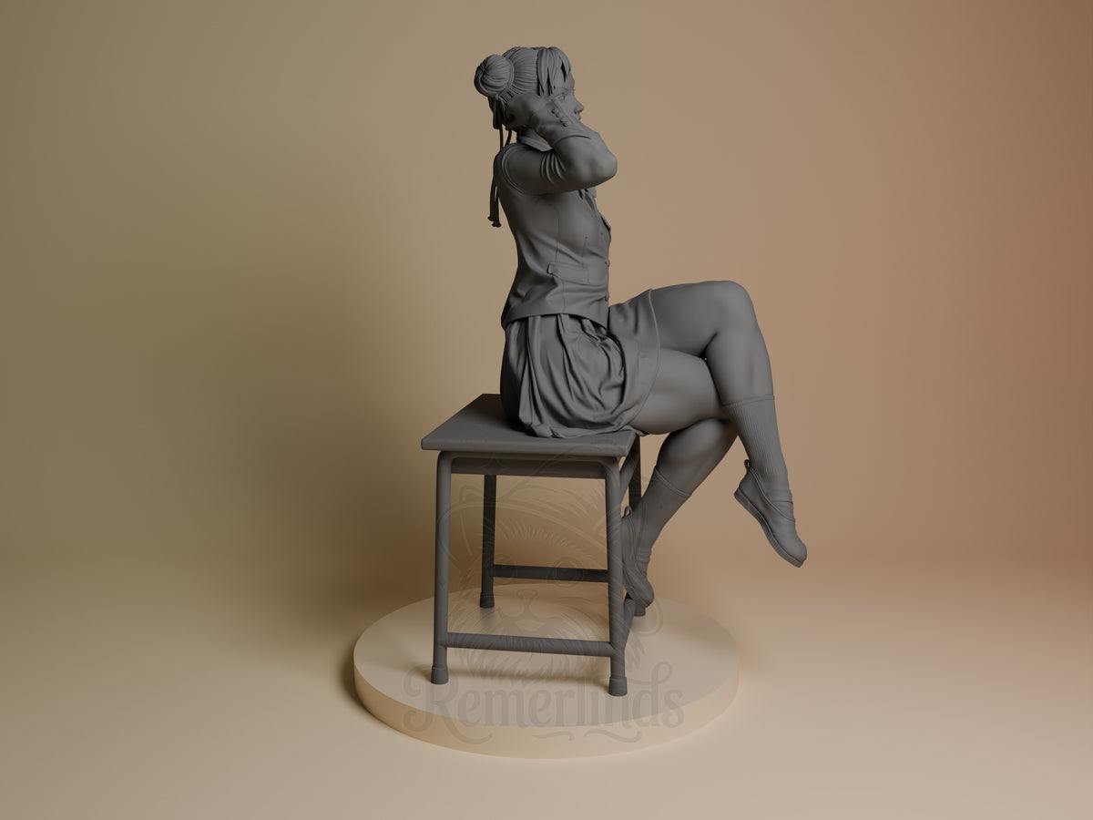 Chun-Li resin figure seated on a stool, shown from the right side in profile pose, displaying sculpted details and neutral gray finish on a wooden base.