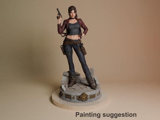 Painted Claire Redfield from Resident Evil resin figure stands on a sculpted base, holding a raised handgun.