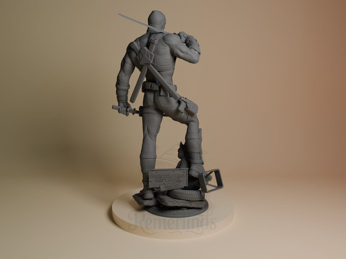 Deadpool resin figure from Antihero Chronicles shown from back, wielding sword over shoulder in dynamic pose, unpainted gray finish on circular base.