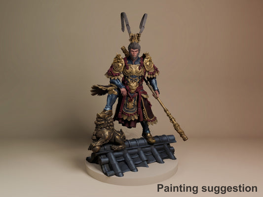 Destined One resin figure from Wukong, painted in gold armor and burgundy robes with tall rabbit ears, holding staff, posed on decorative base with bronze lion sculpture.