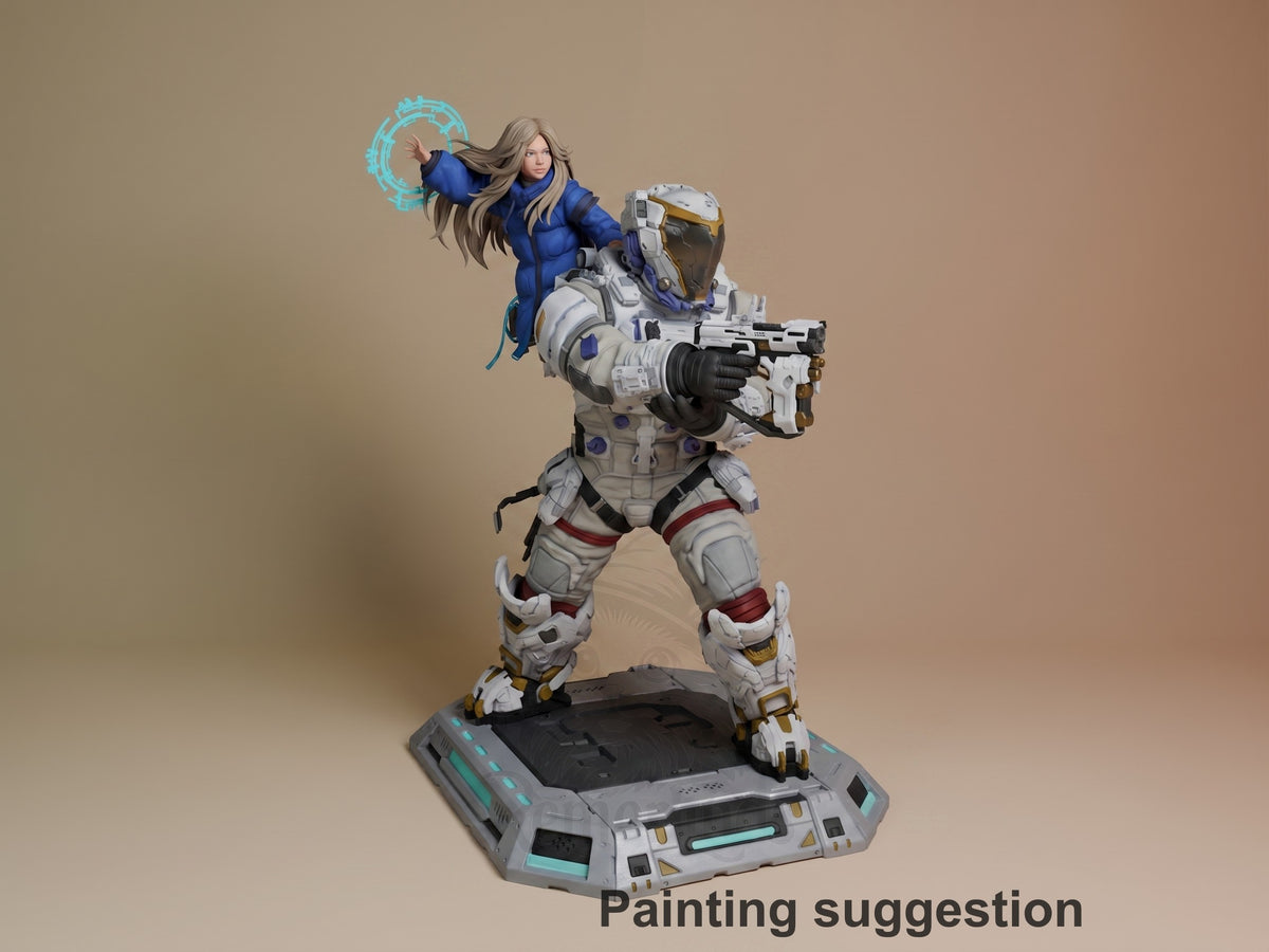 Diana and Hugh resin diorama from Pragmata, fully painted with dynamic pose on futuristic base, shown against tan backdrop.
