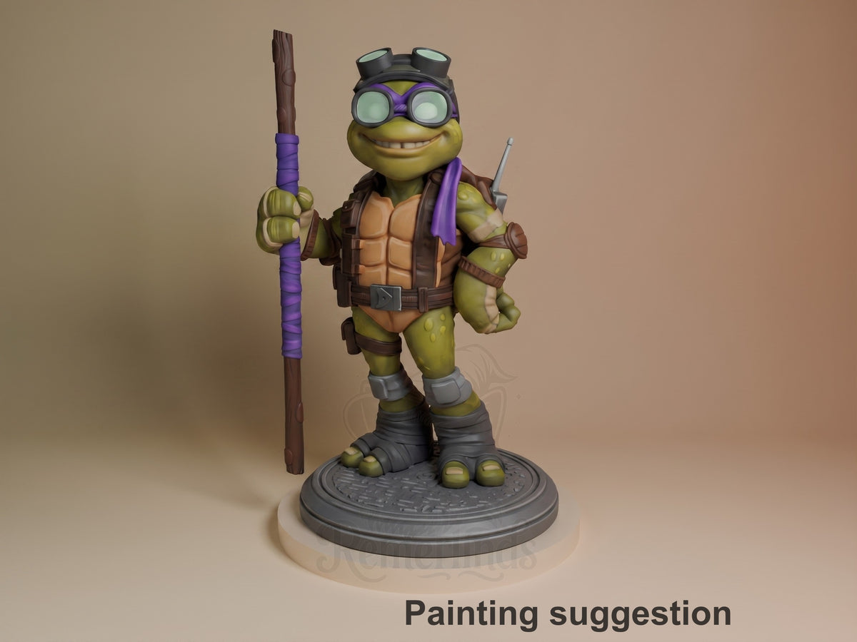 Donatello TMNT resin figure standing on circular base, holding staff, wearing goggles and purple mask, fully painted with brown armor and green skin.