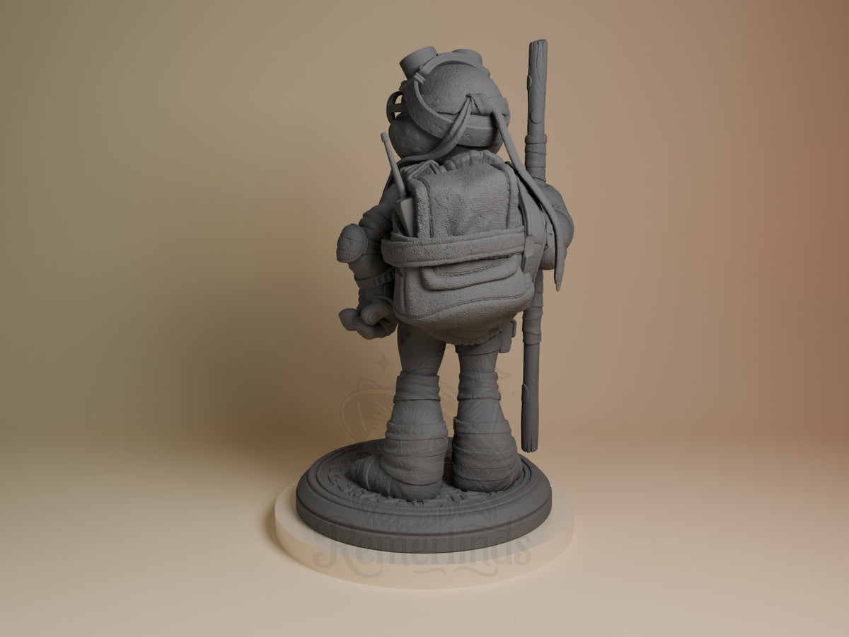 ByteStaff from Shellguard resin figure shown from behind, standing on circular base with backpack and staff, unpainted gray finish.