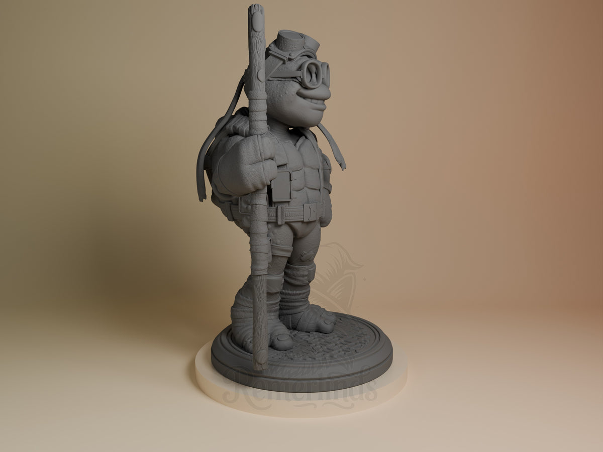 ByteStaff from Shellguard unpainted resin figure shown from right side, standing on circular base with staff over shoulder and goggles on head.