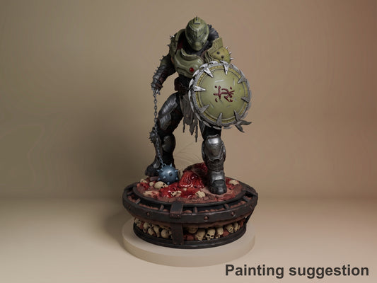 Doom Slayer resin figure in dynamic pose holding large shield and weapon, standing on skull-decorated base, fully painted with metallic armor and tan details.