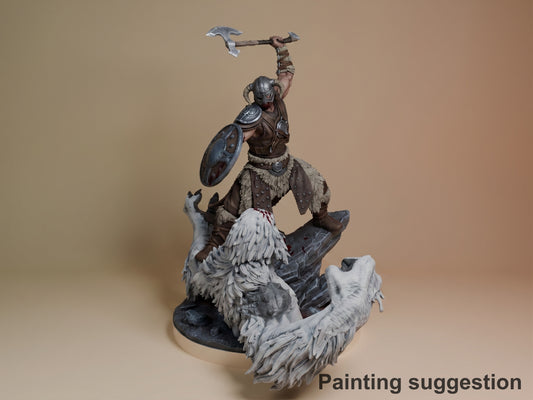 Dragonborn resin figure from Skyrim in heroic pose on rocky base with two white wolves, wielding axe overhead, painted armor and fur details.