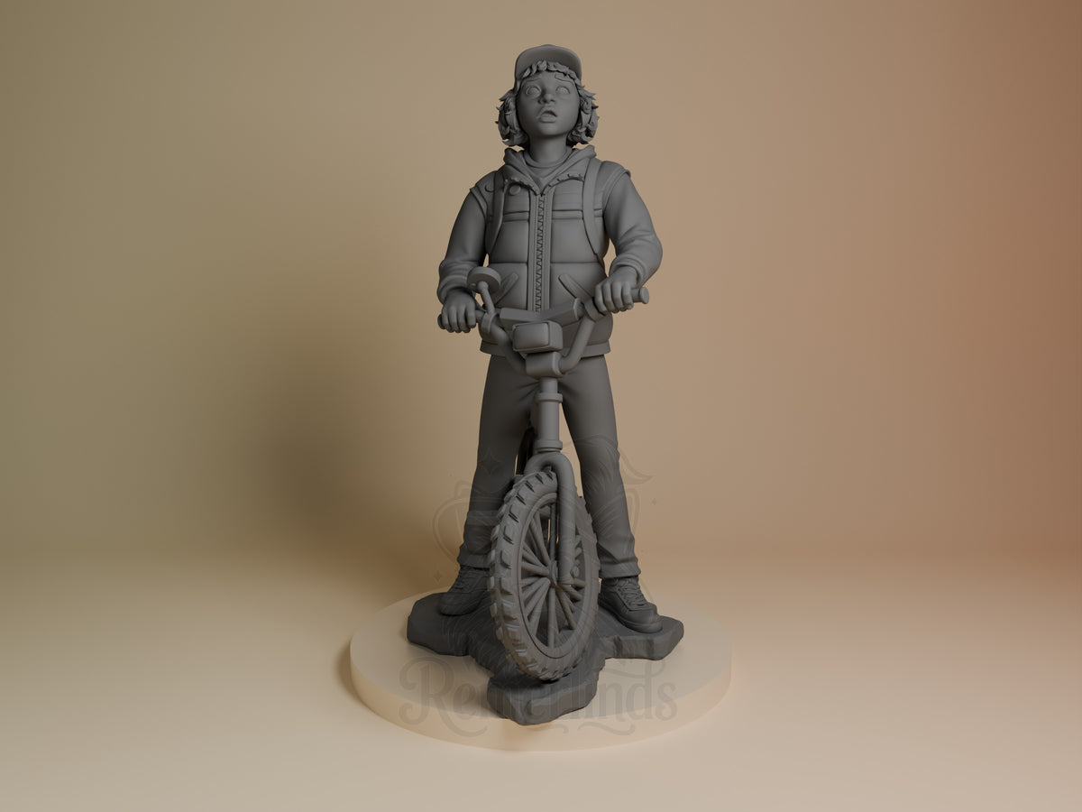 Dustin from Stranger Things stands front-facing as an unpainted resin figure on a sculpted bicycle base.