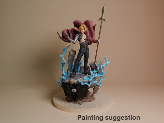 Edward Elric resin figure standing on blue-lit rocky base, holding spear, wearing black coat and red cape, blonde hair visible, fully painted.