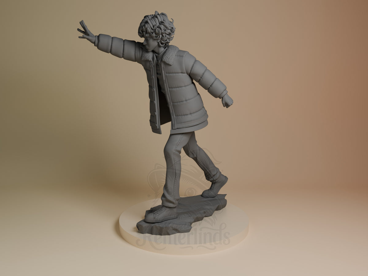 An angled view shows Eleven from Stranger Things as an unpainted resin figure reaching forward on a sculpted base.