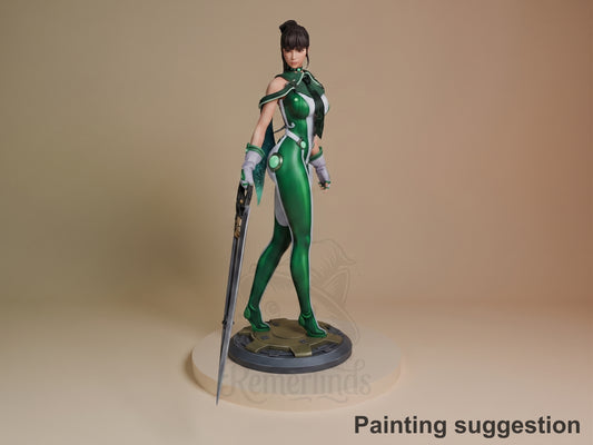 Eve from Stellar Blade resin figure in green bodysuit, posed with sword, fully painted on circular base, shown at three-quarter angle.