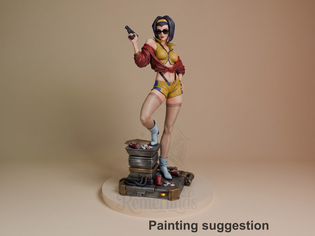 Faye Valentine resin figure in dynamic pose holding pistol, yellow and red outfit, standing on stacked suitcase base with scattered items, fully painted.