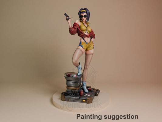 Faye Valentine resin figure in dynamic pose holding pistol, yellow and red outfit, standing on stacked suitcase base with scattered items, fully painted.