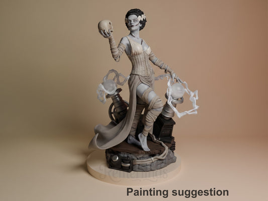 Painted resin figure of Frankenstein's Bride from Frankenstein holds a skull on sculpted base.