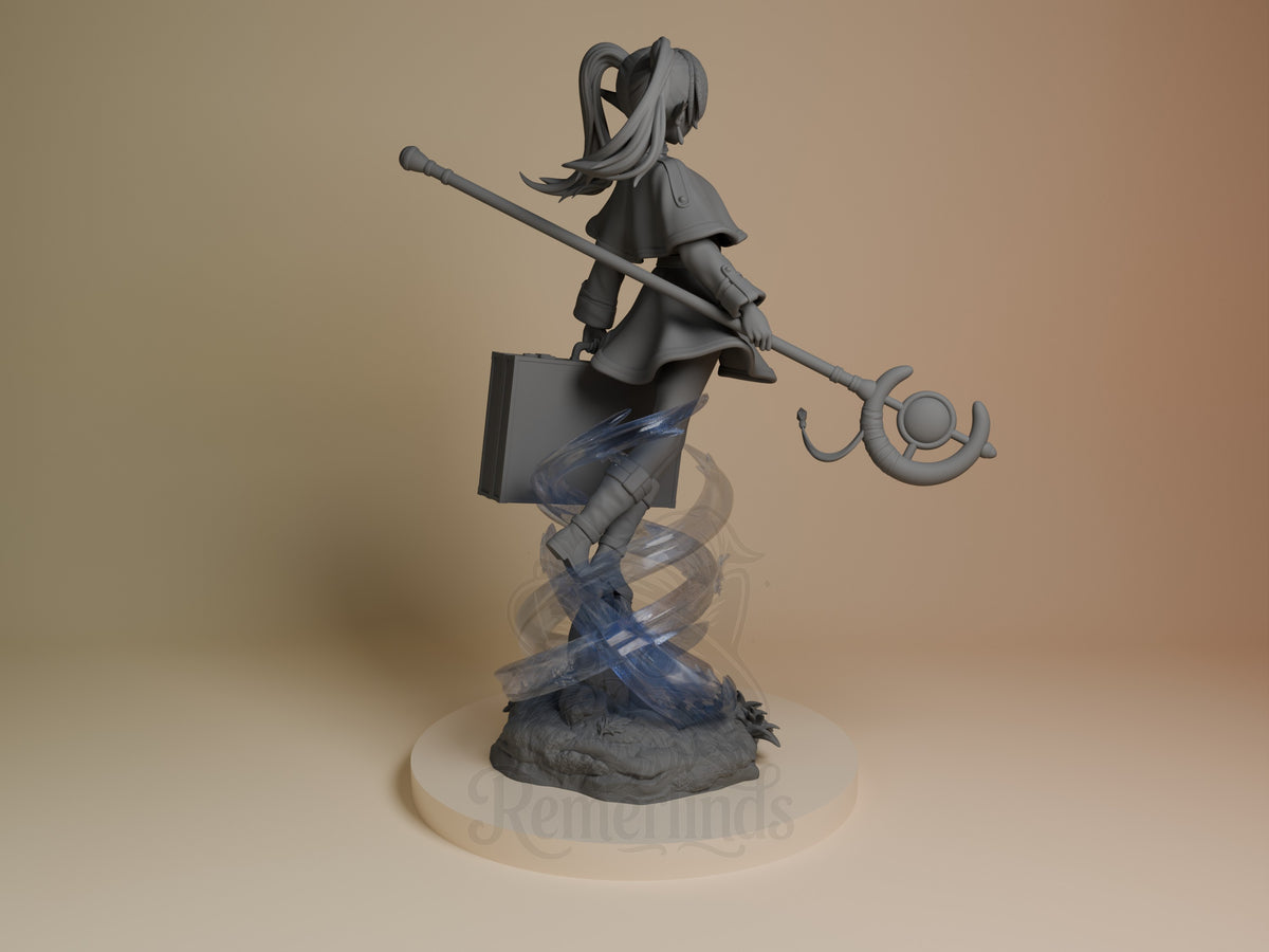 Back view of Frieren from Frieren: Beyond Journey's End, a gray resin figure holding a staff above a sculpted base.