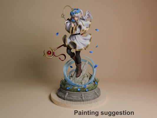 Painted resin figure of Frieren from Frieren: Beyond Journey's End poses with staff on a floral base.