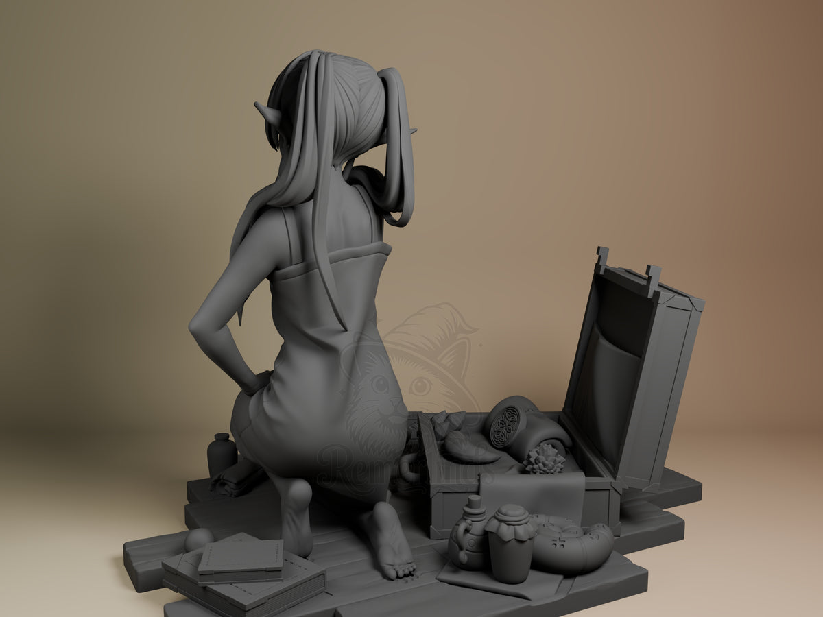Frieren resin figure shown from behind, seated on detailed base with accessories, unpainted gray prototype.
