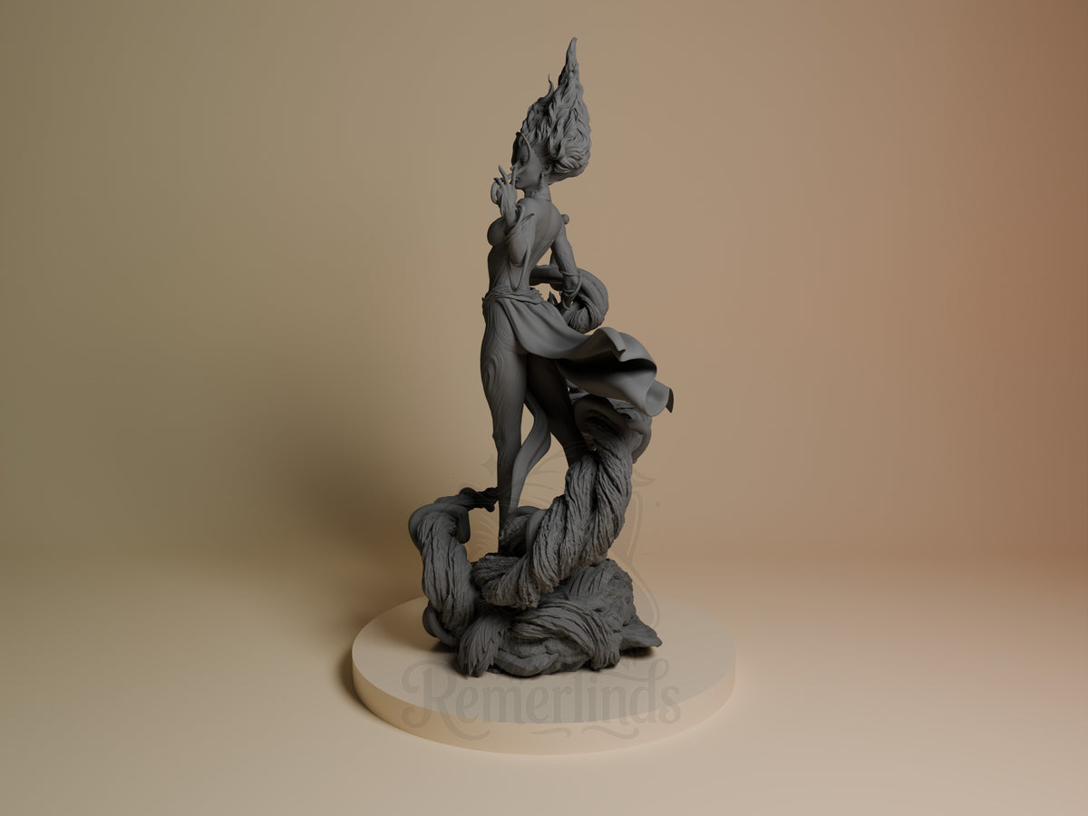 Gaia resin figure shown at angle, featuring stacked humanoid and beast forms with flowing hair details, unpainted gray finish on cream base.