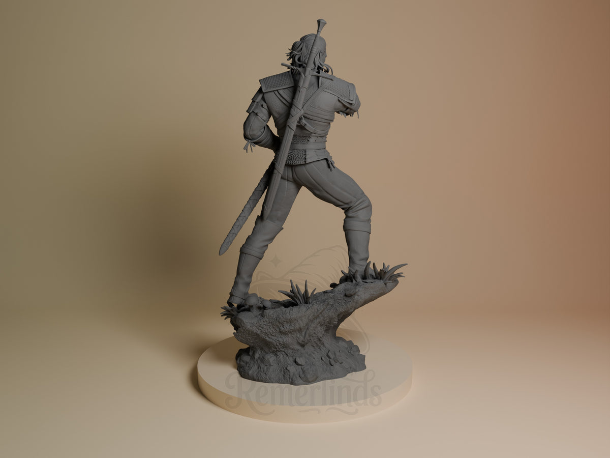 Geralt of Rivia resin figure shown from behind in dynamic sword-drawn pose on rocky base, unpainted gray finish, CA3D Studios.