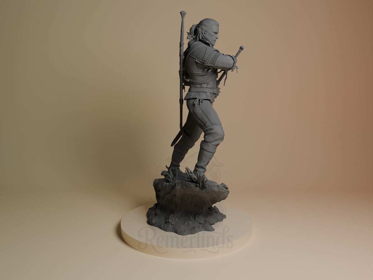 Geralt of Rivia resin figure in right profile, dynamic pose with sword raised, detailed armor and clothing, unpainted gray finish, rocky base.